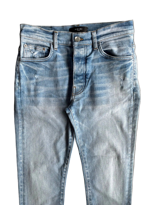 Amiri Light Washed Open Ankle Denim Pants Light blue denim jeans with a faded wash and subtle distressing.