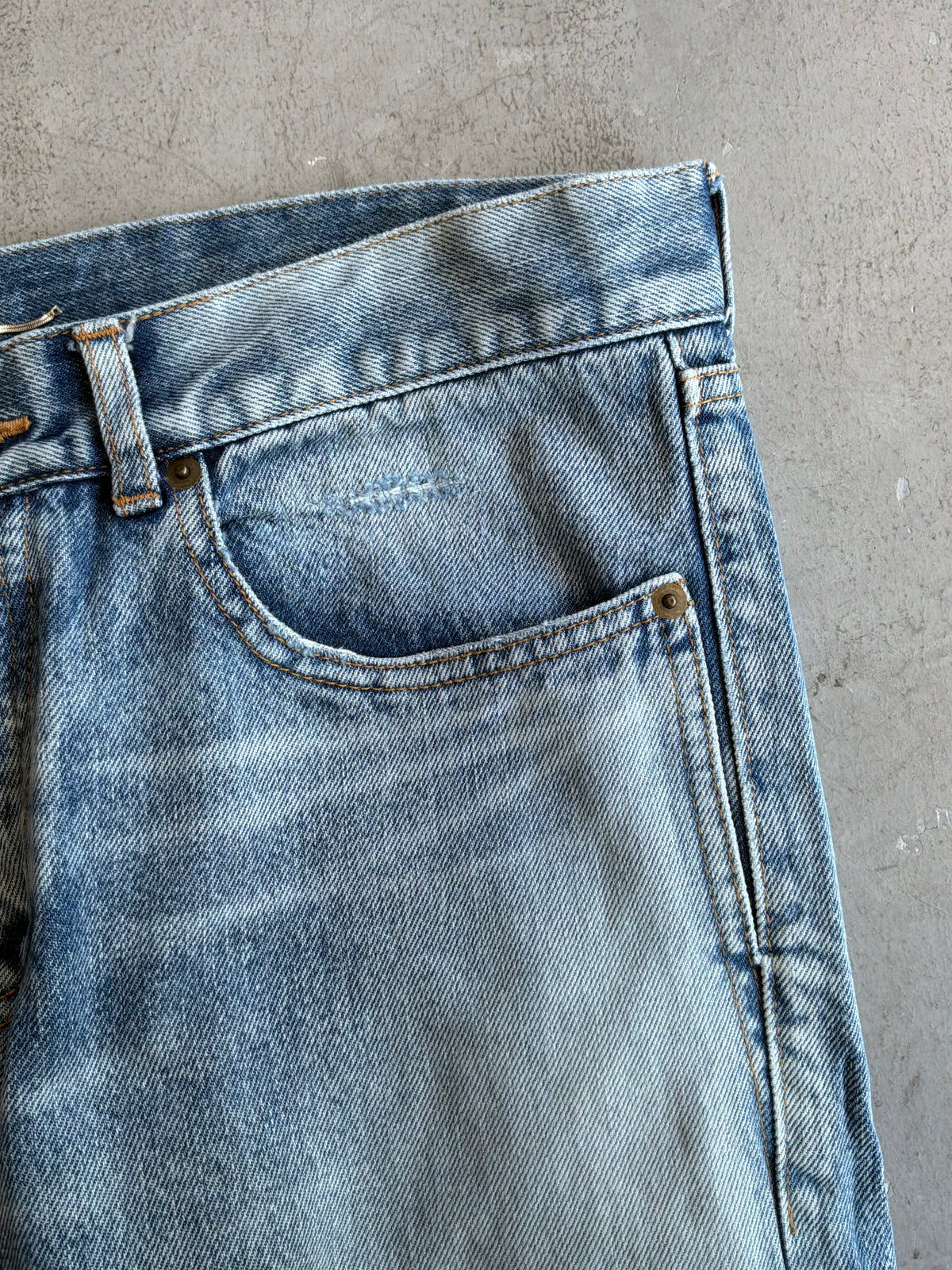 Saint Laurent Paris Distressed Light Wash Denim Pants