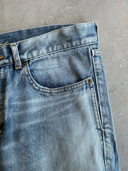 Saint Laurent Paris Distressed Light Wash Denim Pants