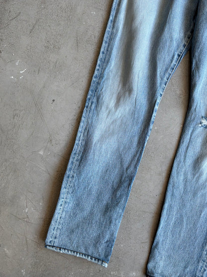 Saint Laurent Paris Distressed Light Wash Denim Pants