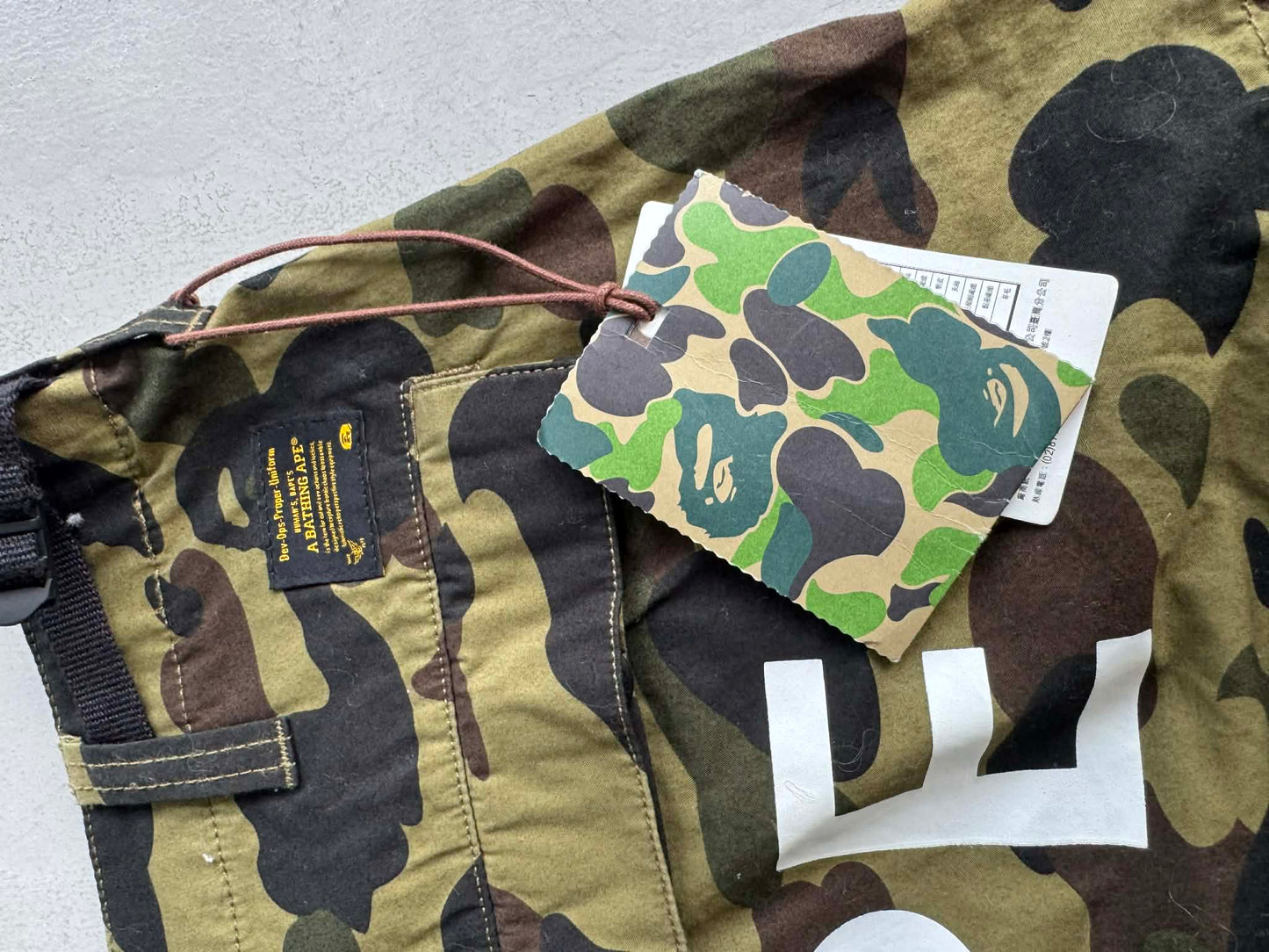 Bape 1st Camo spell out pants