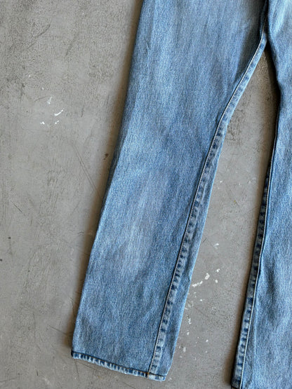 Saint Laurent Paris Distressed Light Wash Denim Pants