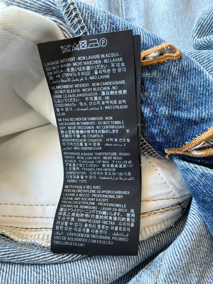 Saint Laurent Paris Distressed Light Wash Denim Pants