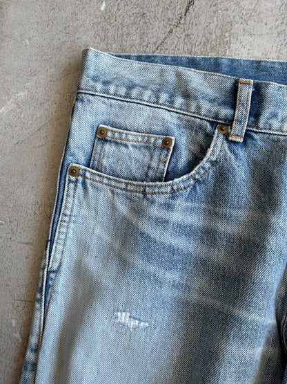 Saint Laurent Paris Distressed Light Wash Denim Pants